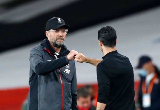 Liverpool manager Jurgen Klopp (left) greets Arsenal manager Mikel Arteta