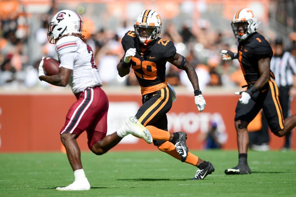 Tennessee defensive backs Brandon Turnage (29) and  Trevon Flowers (1) run down South Carolina running back Juju McDowell (21) in the NCAA college football game between the Tennessee Volunteers and the South Carolina Gamecocks in Knoxville, Tenn. on Saturday, October 9, 2021. 