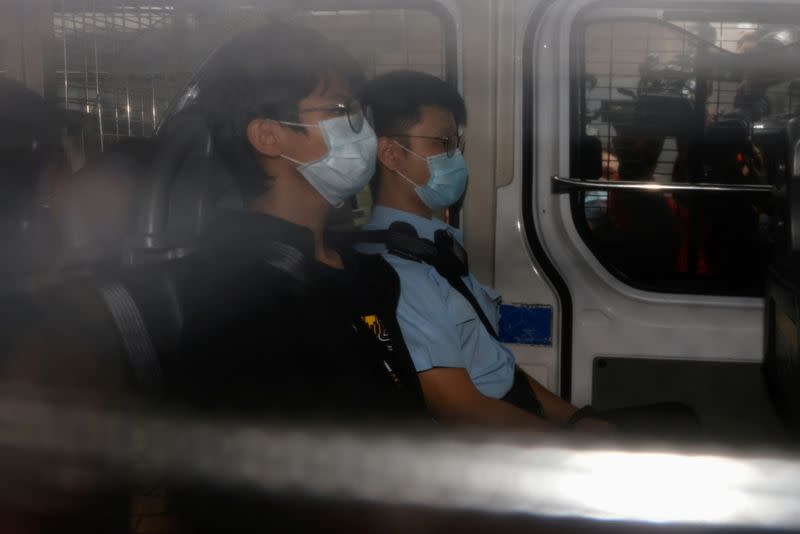 Former convenor of pro-independence group Studentlocalism, Tony Chung Hon-lam arrives at West Kowloon Magistrates‘ Courts in a police van after he was arrested under the national security law, in Hong Kong