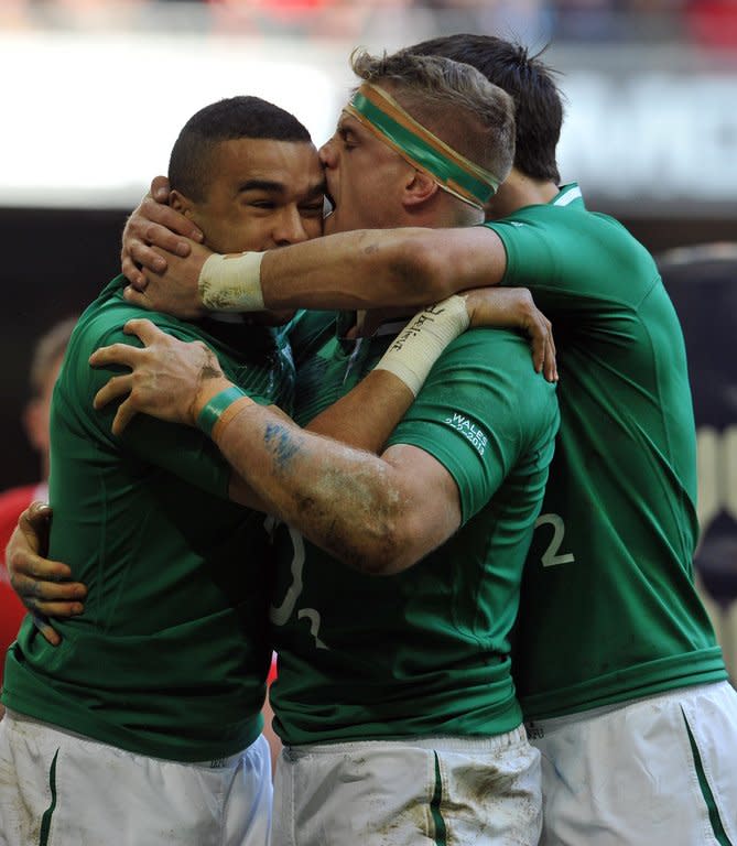 Ireland's Simon Zebo (L) is congratulated by teammate Jamie Heaslip after scoring a try during their Six Nations rugby union match against Wales at The Millennium Stadium in Cardiff, on February 2, 2013. Ireland next play England, on Sunday, at Lansdowne Road in Dublin