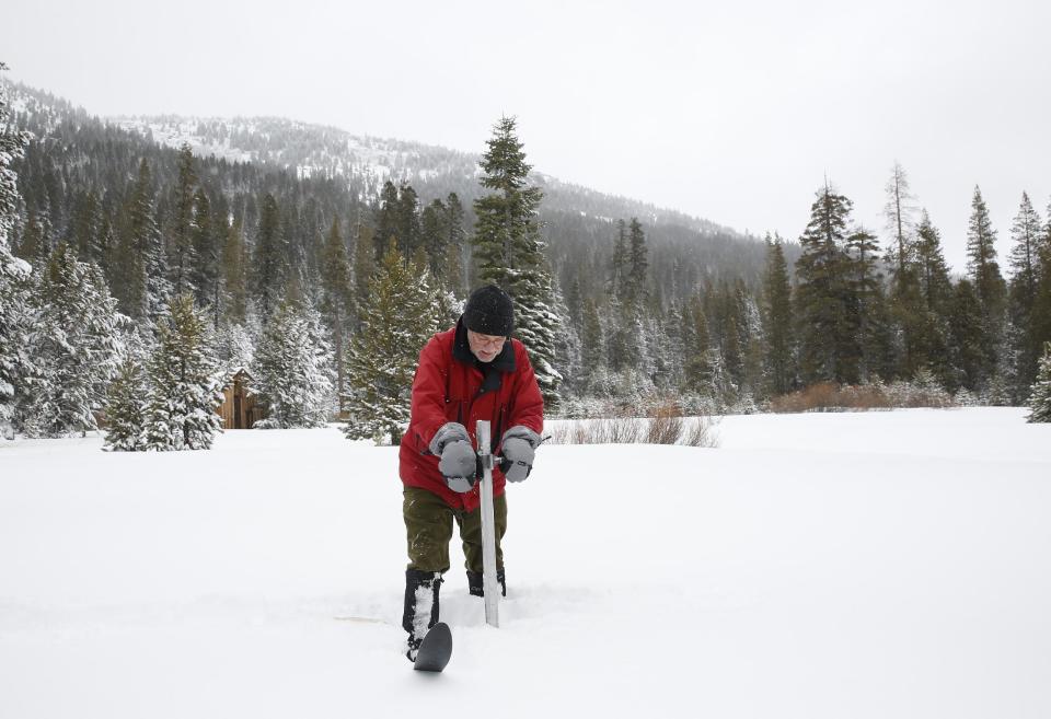 Frank Gehrke, chief of the California Cooperative Snow Surveys Program for the Department of Water Resources, plunges the survey tube into the snowpack as he conducts the first snow survey of the season at Phillips Station Tuesday, Jan. 3, 2017, near Echo Summit, Calif. The survey showed the snowpack at 53 percent of normal for this site at this time of year. (AP Photo/Rich Pedroncelli)