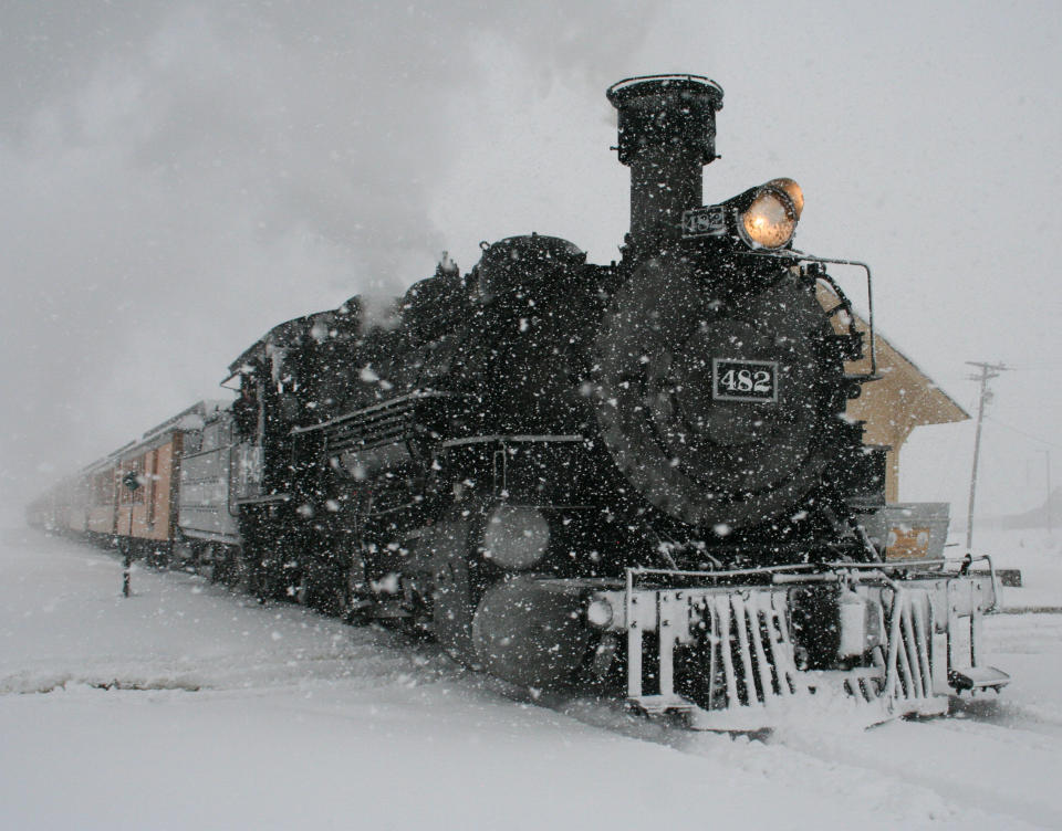 A Durango & Silverton Narrow Gauge Railroad passenger train arrives in Silverton, Colo., on Sunday, May 11, 2014, amid a severe snowstorm that dropped more than a foot on the San Juan Mountains of southwest Colorado. (AP Photo/Silverton Standard, Mark Esper)