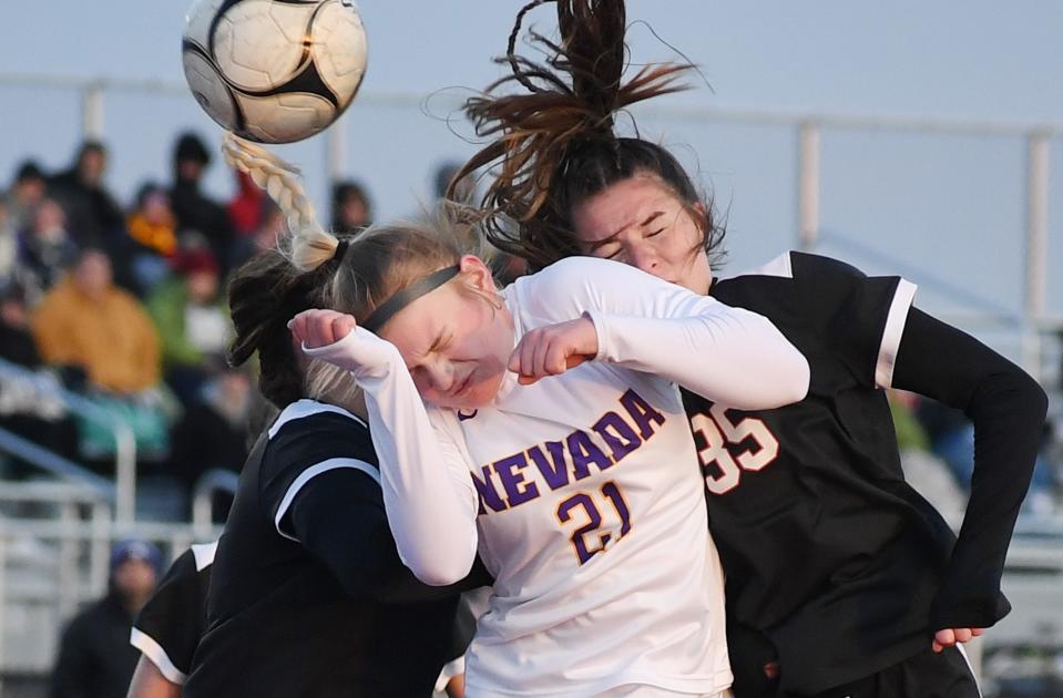 Nevada defender Graci Schiller (21) and Gilbert forward Katherine O'Brien (35) attempt to head the ball during the first half of the Cubs' 1-0 shootout victory over the Tigers Monday at Tiger Stadium in Gilbert.
