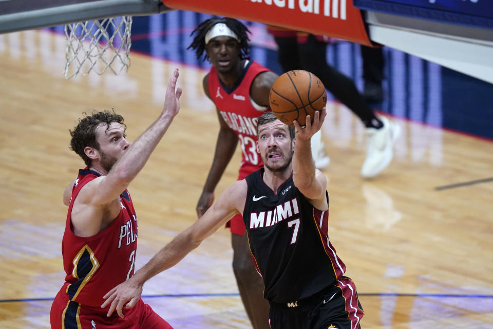 Miami Heat guard Goran Dragic (7) goes to the basket against New Orleans Pelicans forward Nicolo Melli during the first half of an NBA basketball game in New Orleans, Thursday, March 4, 2021. (AP Photo/Gerald Herbert)
