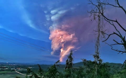 Lightning streak over Batangas as Taal Volcano continue its eruption on Sunday evening. - Credit: Alamy&nbsp;