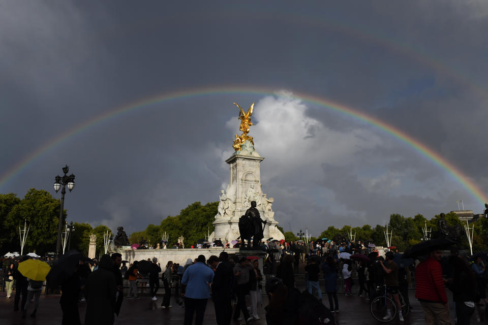 Tourist gather near a double rainbow over Queen Victoria Memorial outside Buckingham Palace in London, UK, on Thursday, Sept. 8, 2022. The doctors for Queen Elizabeth II say they are 