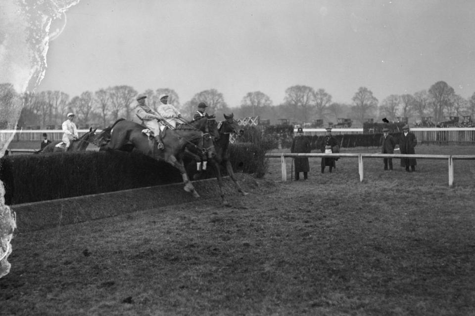 Vermouth (the winning horse), Irish Mail and Schoolmoney take the fence at the Grand National substitute race at Gatwick in 1916 (Getty Images)