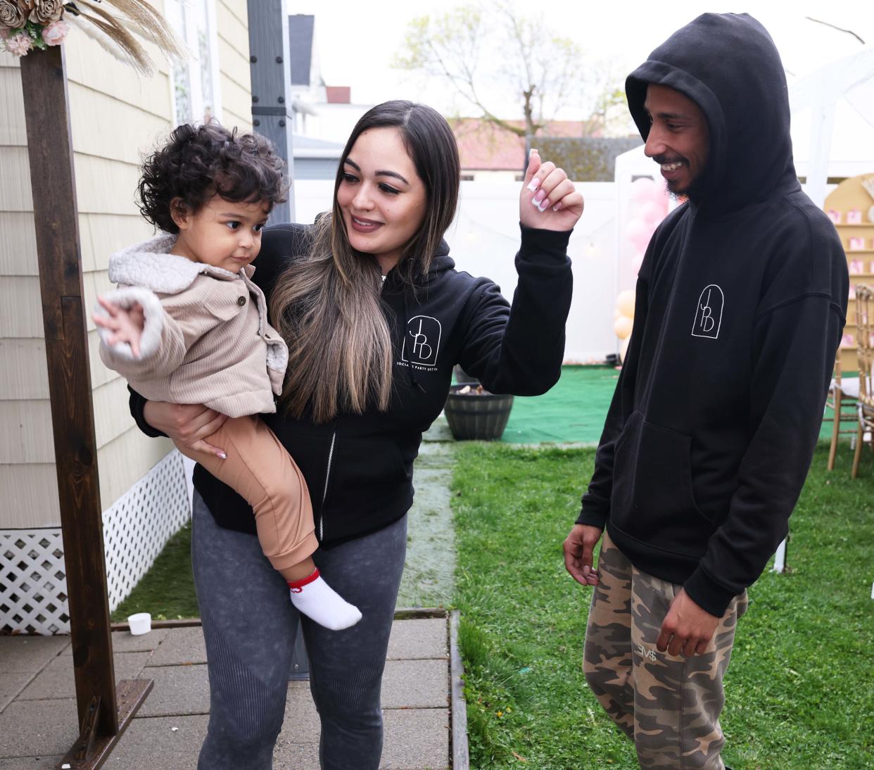 Cynthia Viruet owner of Jociahs Party Decor (JPD) with Rejay Fernandes and their son Jociah at a house party at North Main Street in Brockton on Saturday, April 20, 2024.