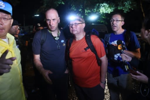 British cave divers Richard William Stanton (2nd-L), Robert Charles Harper (3rd-L) and John Volanthen (R) have joined the search