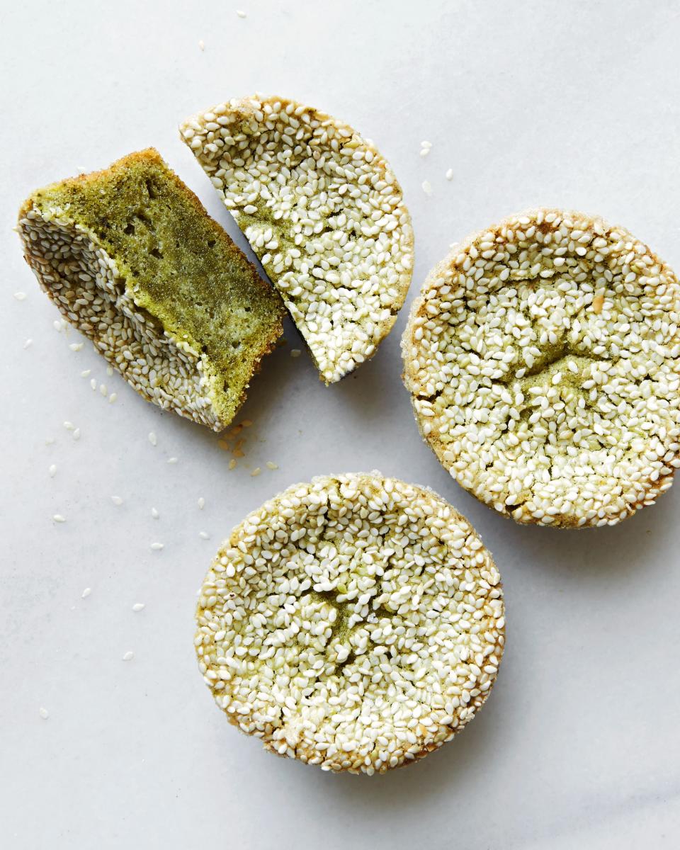 These cupcakes are made with coconut milk and butter, with cinnamon and matcha powder added and sesame seeds on top.