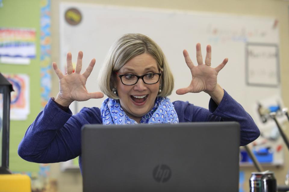 LOUISVILLE, KENTUCKY - APRIL 15:  Joanne Collins Brock , a second grade teacher at St Francis School (Goshen) , teaches online in her empty classroom on April 15, 2020 in Goshen, Kentucky.  Brock has been teaching daily online to her students because of the closure of schools in Kentucky due to the Coronavirus (COVID-19) pandemic. (Photo by Andy Lyons/Getty Images)