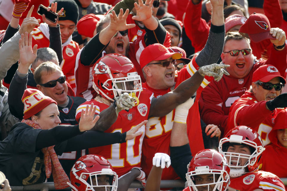 Kansas City Chiefs wide receiver Tyreek Hill (10) celebrates a touchdown against the Arizona Cardinals with fans during the first half of an NFL football game in Kansas City, Mo., Sunday, Nov. 11, 2018. (AP Photo/Charlie Riedel)