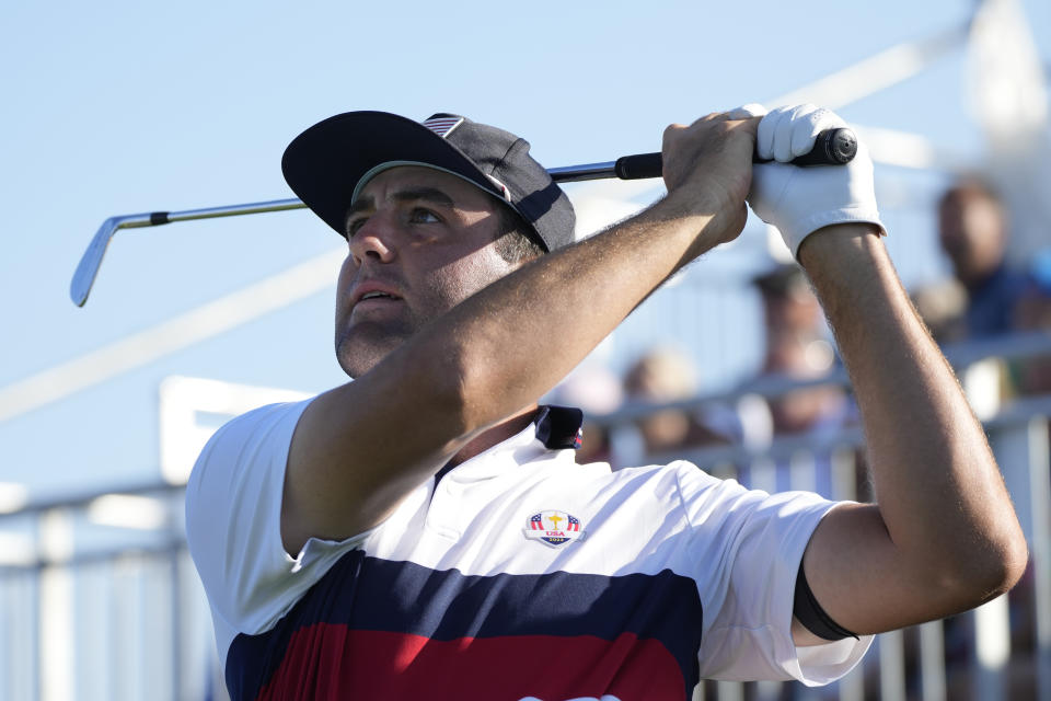 United States' Scottie Scheffler play his tee shot on the 7th hole during his morning Foursomes match at the Ryder Cup golf tournament at the Marco Simone Golf Club in Guidonia Montecelio, Italy, Saturday, Sept. 30, 2023. (AP Photo/Alessandra Tarantino)