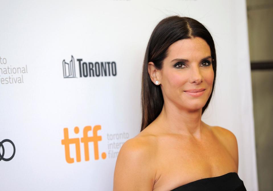 FILE - In this Sept. 8, 2013 file photo, actress Sandra Bullock arrives at the premiere of "Gravity" on day 4 of the Toronto International Film Festival at The Princess of Wales Theatre, in Toronto. Bullock says making the lost-in-space movie “Gravity” with director Alfonso Cuaron was her “best life decision” ever. The film releases in US theatres Friday, Oct. 4, 2013. (Photo by Chris Pizzello/Invision/AP, File)