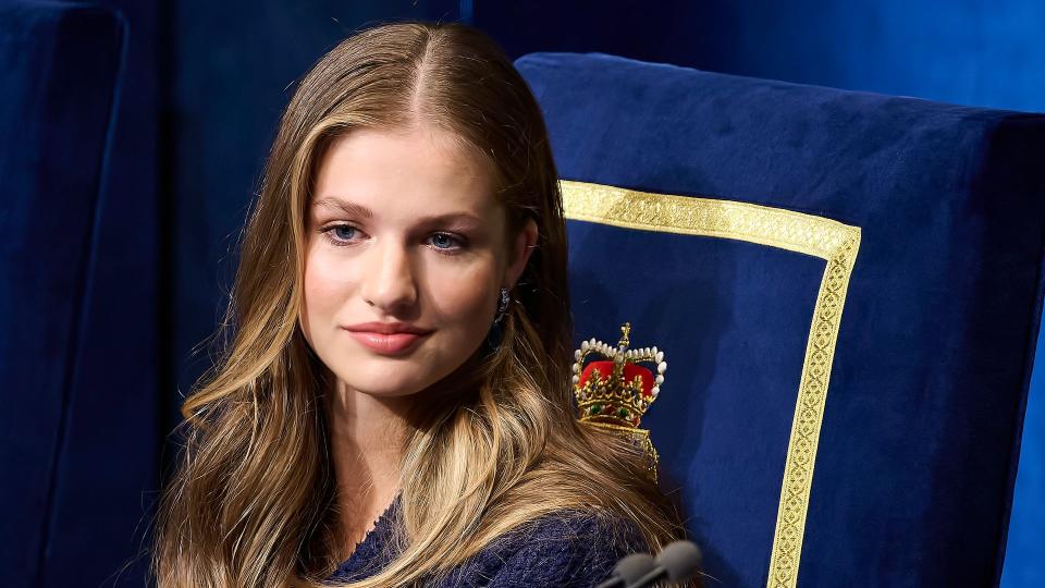 Princess Leonor in a blue outfit on a blue chair