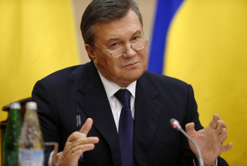 Ukraine's fugitive President Viktor Yanukovych speaks at a news conference in Rostov-on-Don, a city in southern Russia about 1,000 kilometers (600 miles) from Moscow, Friday, Feb. 28, 2014. Yanukovych, making his first public appearance since fleeing Ukraine, said he was forced to leave the country after his family received threats. (AP Photo/Pavel Golovkin)