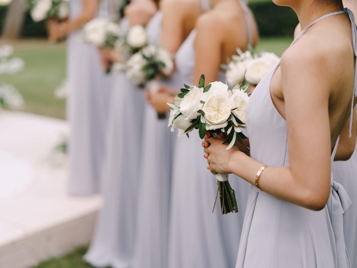bridesmaid standing in a line at a wedding ceremony