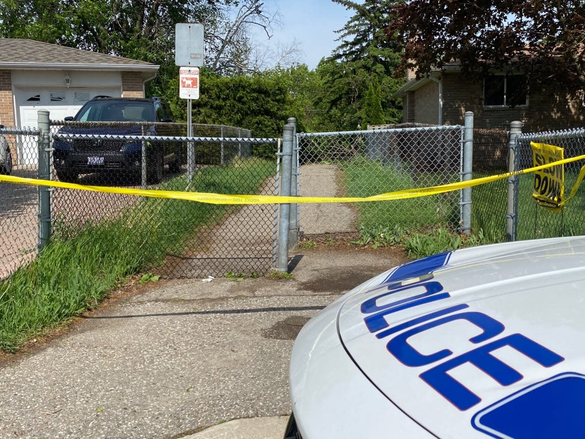 Peel police say a woman was reportedly walking between two houses in Brampton when a tree fell on top of her. (Grant Linton/CBC - image credit)