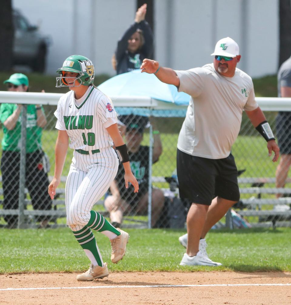 Wilmington's Sara Miller heads for home past head coach Mike Shehorn after her two-run home run in the Wildcats' 2-1 win against Pace in their opening game of the NCAA Division II regional tournament at Wilmington University Thursday, May 11, 2023. The Wildcats meet Georgian Court in the winners bracket Friday at 10a.m. at Asbury Field.