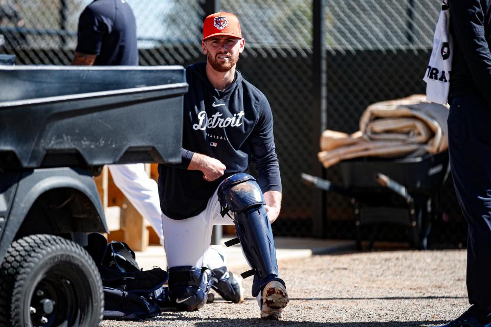 Detroit Tigers catcher Carson Kelly puts on catcher gear during spring training at TigerTown in Lakeland, Fla. on Tuesday, Feb. 20, 2024.