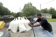 <p>Keiyon Martin, 13, organizes the sandbags he and his cousin filled for their families’ homes in Cheek after filling them at the Jefferson County Precinct 4 Service Center on June 20, 2017. (Photo: Kim Brent/Beaumont Enterprise via AP) </p>