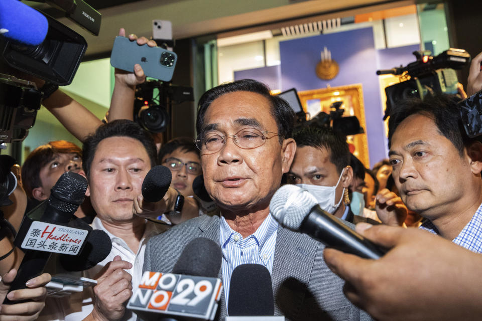 Thailand's Prime Minister Prayuth Chan-ocha leaves from United Thai Nation Party headquarters in Bangkok, Thailand, Sunday, May 14, 2023. Thailand's main opposition party took an early lead in a vote count from Sunday's general election, touted as a pivotal chance for change nine years after incumbent Prime Minister Prayuth Chan-ocha first came to power in a 2014 coup. (AP Photo/Rapeephat Sitichailapa)