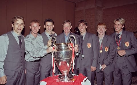 The famous 'Class of '92' with their youth team coach Eric Harrison after Manchester United won the 1999 European Cup - Credit: Getty Images