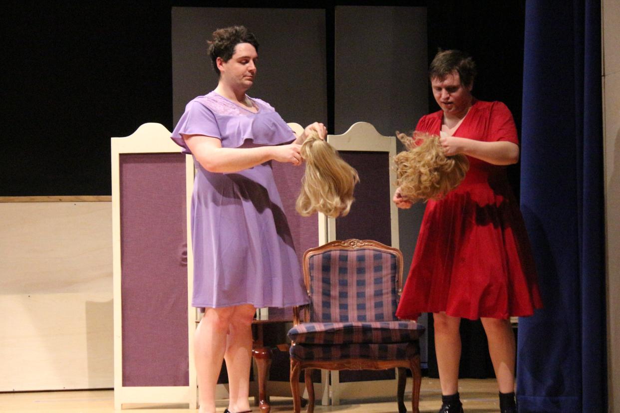 From left, James Gillis and Alex Gardner don their wigs during rehearsal for "Leading Ladies" in Shrewsbury.