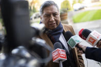 The Bolivian Foreign Minister, Rogelio Mayta, answers questions outside the World Court in The Hague, Netherlands, Thursday, Dec. 1, 2022, where the UN's top court rules on a dispute about a river that crosses Chile's and Bolivia's border, in a case seen as important jurisprudence at a time when fresh water is becoming an increasingly coveted world resource. (AP Photo/Peter Dejong)