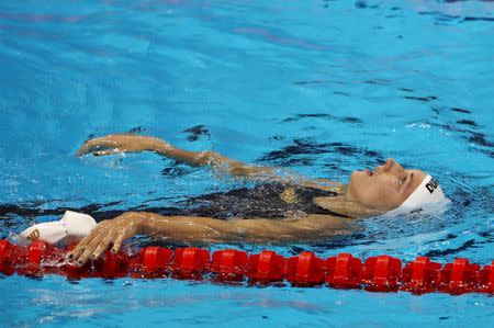 Katinka Hosszu (HUN) of Hungary celebrates setting a new world record and winning the gold medal. REUTERS/Marcos Brindicci