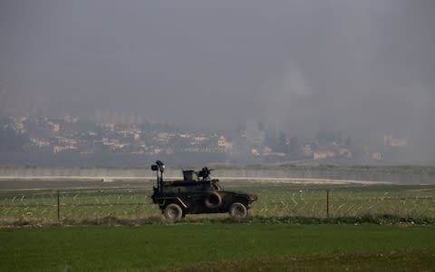 Smoke rises from Kurdish-controlled Afrin - Credit: Cem Genco/Anadolu Agency/Getty Images