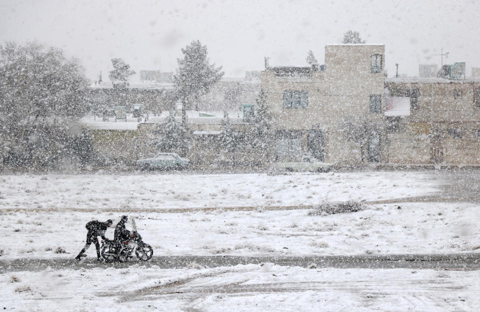 The runner-up picture in the Young Weather Photographer of the Year 2019 category, "Motorcycle Caught in the Snow", taken by Ali Bagheri (Picture: PA)