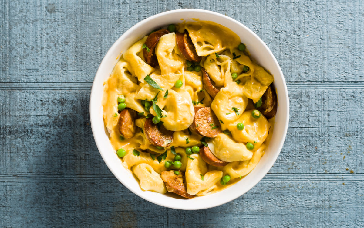 <p>Parade</p><p>This smoky, cheesy dish from Dee Martin is full of shortcuts, from using kielbasa, a fully-cooked smoked Polish sausage, to frozen peas and dried minced onions.</p><p><strong>Get the recipe: <a href="/842629/communitytable/creamy-kielbasa-tortellini/" data-ylk="slk:Creamy Kielbasa Tortellini;elm:context_link;itc:0;sec:content-canvas" class="link rapid-noclick-resp">Creamy Kielbasa Tortellini</a></strong></p>