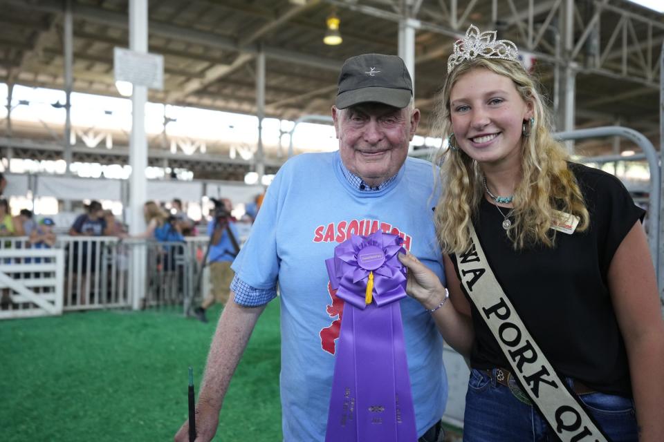 Wilbur Kehrli poses with the Iowa Pork Queen after Sasquatch was named the 2023 Big Boar.