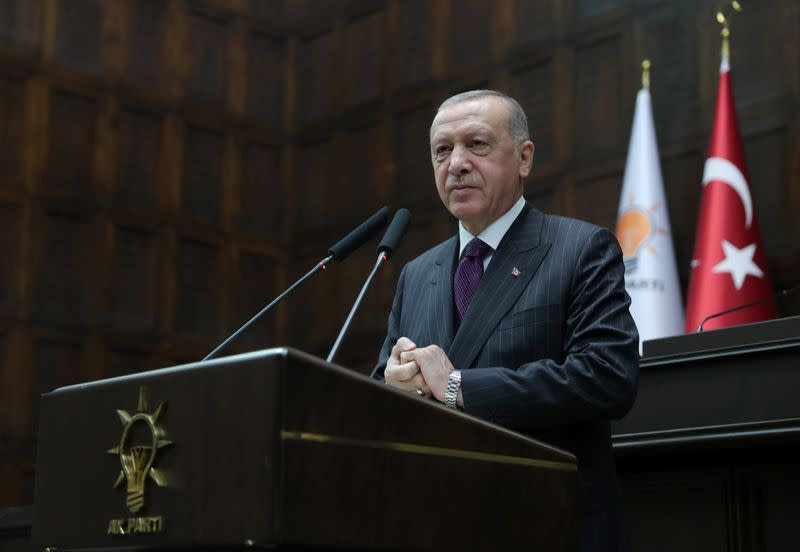 Turkish President Erdogan addresses members of his ruling AKP during a meeting at the parliament in Ankara