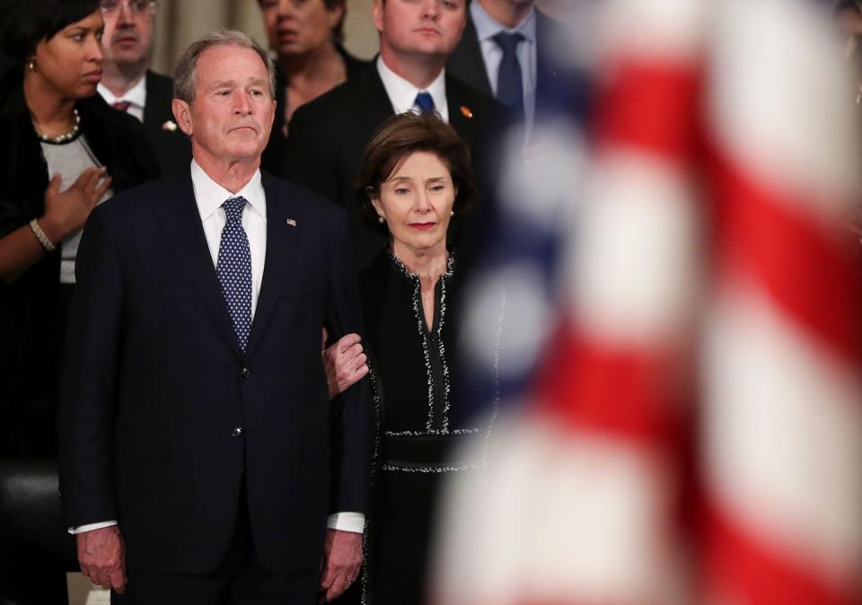 12) George W. Bush and Laura Bush watch as the remains are carried into the Rotunda.
