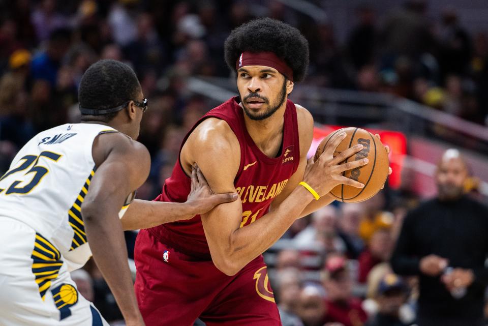 Cavaliers center Jarrett Allen looks to make a play while Pacers forward Jalen Smith defends in the second half, March 18, 2024, in Indianapolis
