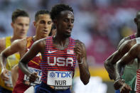 Abdihamid Nur, of the United States,, competes in the men's 5000-meters heats during the World Athletics Championships in Budapest, Hungary, Thursday, Aug. 24, 2023. (AP Photo/Ashley Landis)