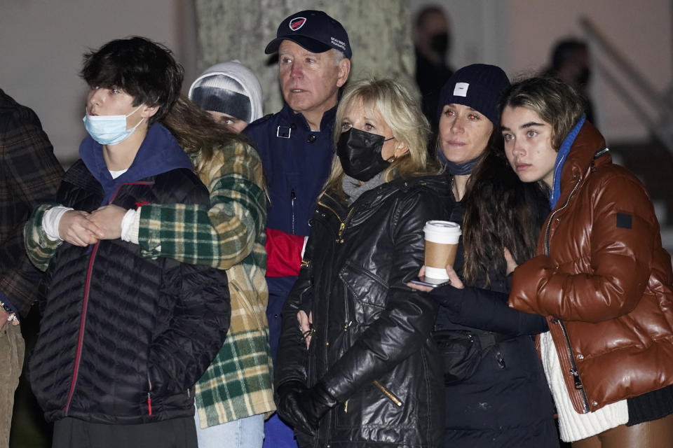 President Joe Biden and first lady Jill Biden stand with members of their family including grand children Hunter Biden, Finnegan Biden and Natalie Biden, and daughter Ashley Biden during a tree lighting ceremony in Nantucket, Mass., Friday, Nov. 26, 2021. (AP Photo/Carolyn Kaster)