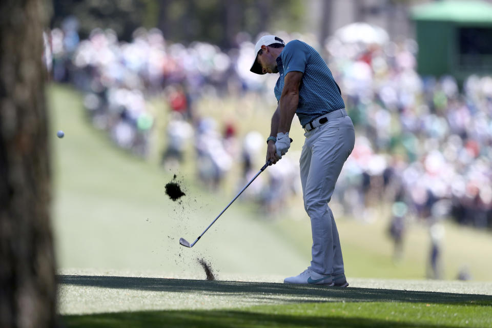 Rory Mcllroy hits his second shot on the first fairway during the final round of the Masters golf tournament, Sunday, April 10, 2022, in Augusta, Ga. (Curtis Compton/Atlanta Journal-Constitution via AP)