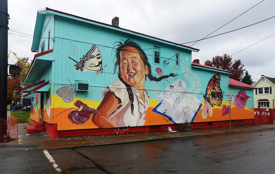 A mural, created by artist Ana Balcazar from Peru and titled "Joy," adorns the east wall of a building at 562 E. 12th St. in Erie in this Nov. 9, 2022, file photo. Part of the two-year "Purposeful Placemaking mural project" coordinated by Erie Arts & Culture, the murals are located near Erie School District walking bus routes, which are designated areas where children and families typically walk to and from neighborhood schools.