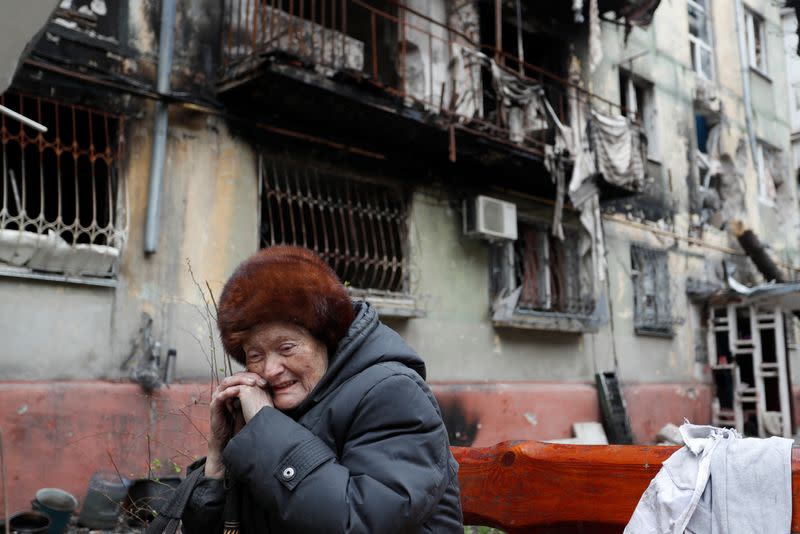 A view shows a damaged residential building in Mariupol