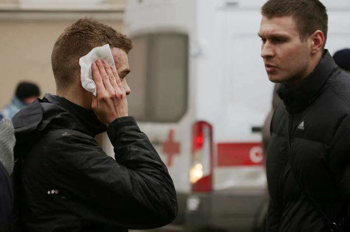 <p>An injured person stands outside Sennaya Ploshchad metro station in St. Petersburg, Russia, April 3, 2017. (Anton Vaganov/Reuters) </p>