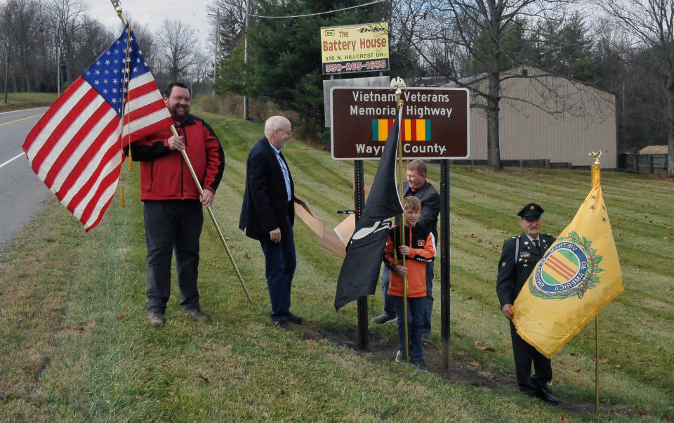 The new sign renaming part of Old Lincolnway West as the Vietnam Veterans Memorial Highway was uncovered after the Veterans Day program.