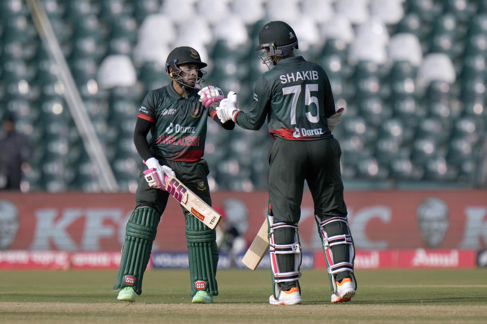 Bangladesh's Mushfiqur Rahim, left, celebrates with Shakib Al Hasan after playing a shot for boundary during the Asia Cup cricket match between Pakistan and Bangladesh in Lahore, Pakistan, Wednesday, Sept. 6, 2023. (AP Photo/K.M. Chaudary)