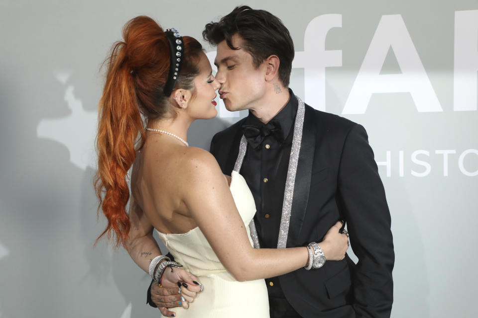 Bella Thorne, left, and Benjamin Mascolo pose for photographers upon arrival at the amfAR Cinema Against AIDS benefit the during the 74th Cannes international film festival, Cap d'Antibes, southern France, Friday, July 16, 2021. (Photo by Vianney Le Caer/Invision/AP)