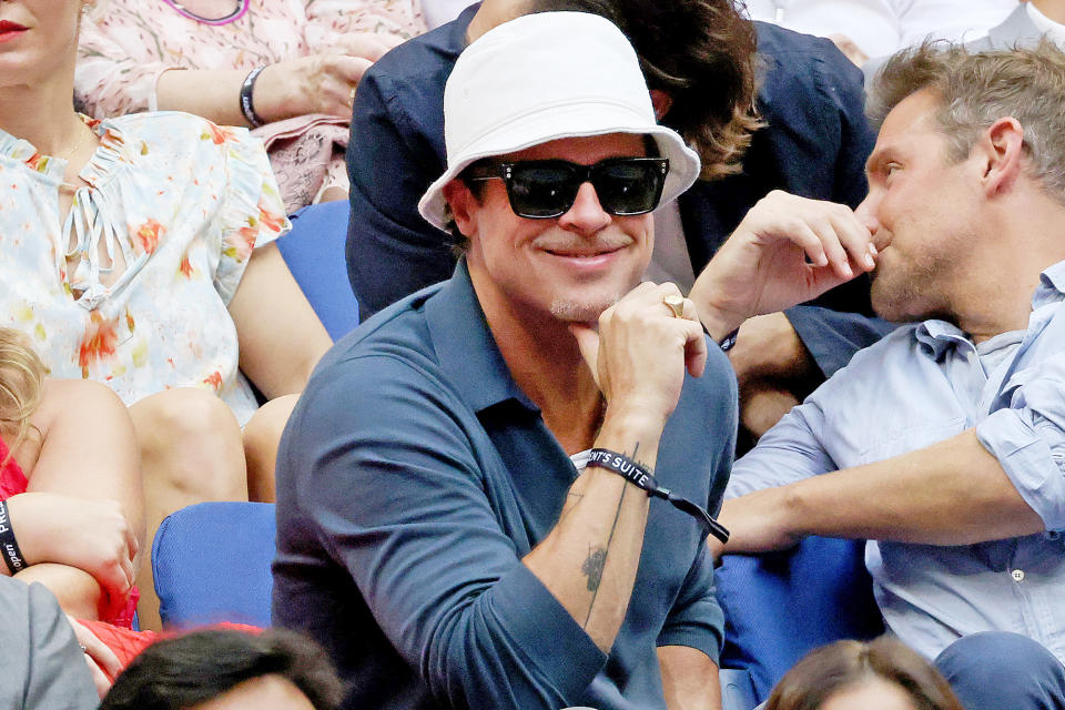 <p>Brad Pitt (next to Bradley Cooper) attends the men's singles final at the 2021 U.S. Open inside Arthur Ashe Stadium at the Billie Jean King Tennis Center in Flushing, New York, on Sept. 12.</p>