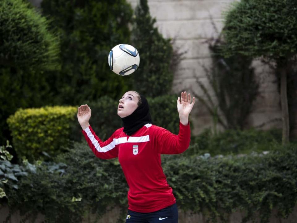 An Iranian soccer player wears a hijab, something now not permitted in France because of a French Football Federation policy. (AFP via Getty Images - image credit)