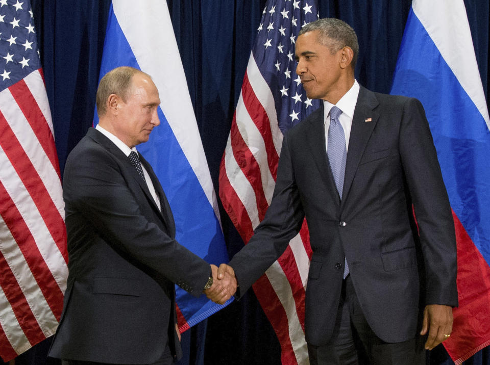 FILE - In this Sept. 28, 2015 file photo, President Barack Obama shakes hands with Russian President President Vladimir Putin before a bilateral meeting at United Nations headquarters. (AP Photo/Andrew Harnik, File)