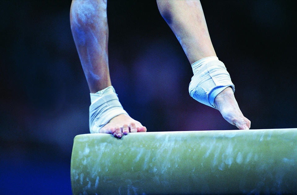 Woman on balance beam